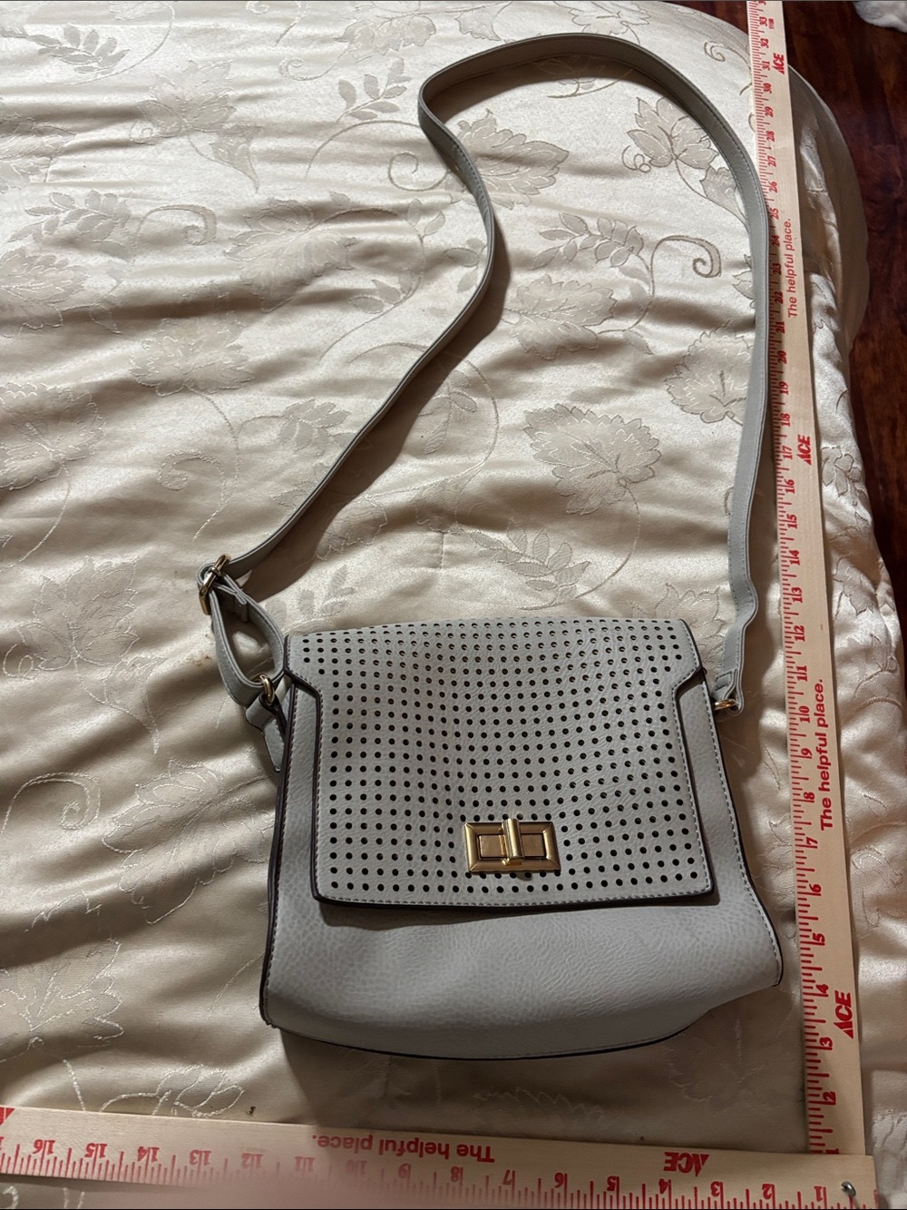 Gussachi Perforated Light Gray Crossbody Bag with Gold Turn-Lock